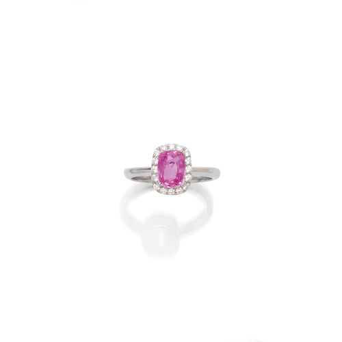 PINK SAPPHIRE AND DIAMOND RING. White gold 750. Set with 1 pink sapphire weighing 1.75 ct, unheated, within a border of 16 brilliant-cut diamonds weighing ca. 0.20 ct. Size ca. 54. With AIGS Report No. GF13120550, December 2013.