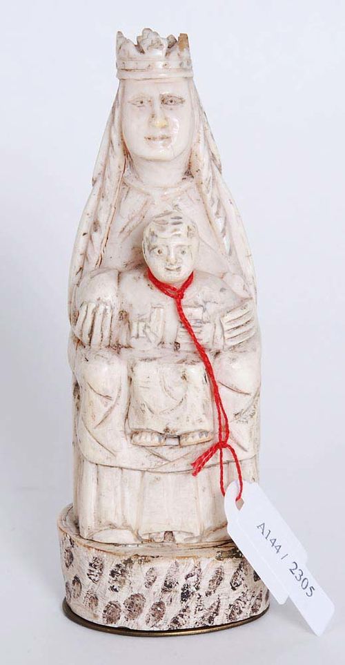 MADONNA AND CHILD ENTHRONED,Romanesque style, 19th century Carved ivory. H 13 cm.