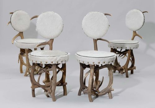 SUITE OF 4 CHAIRS, from theAlpine region. Antlers and light coloured hide. Round, padded seat and backrest on a deer antler frame.