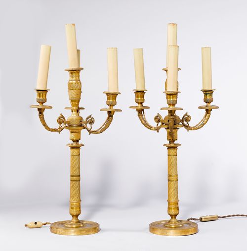 PAIR OF CANDELABRAS,France, Restoration. Gilt bronze. Cylindrical shaft with 4 light branches. Vase-shaped nozzles and round drip pans. On a round base. H 42 cm. Fitted for electricity.
