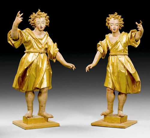 PAIR OF STANDING ANGELS,Baroque, Northern Italy or Austria, 17th century Fully carved, painted and parcel gilt wood. H 81 cm. Finger incomplete in parts, the wings missing.