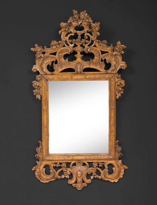 SMALL CARVED OAK MIRROR,Louis XV, Aachen-Liege circa 1750/60. Carved with flowers, leaves and cartouches. H 95 cm, W 52 cm. Provenance: Belgian private collection  .