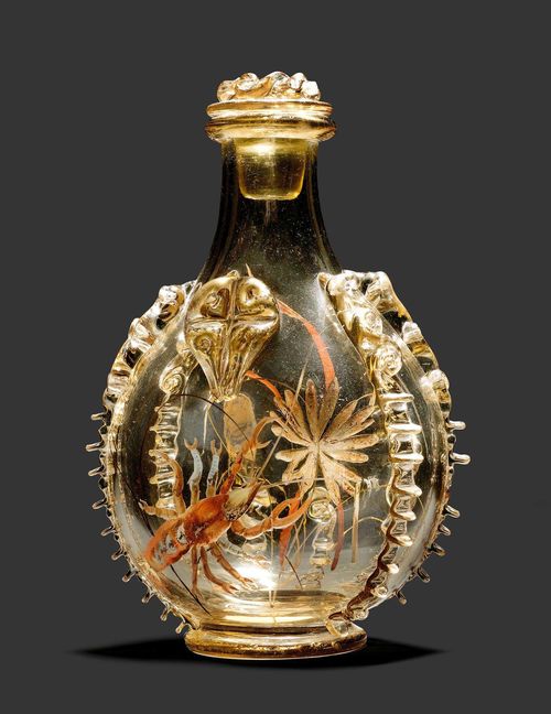 EMILE GALLE SMALL BOTTLE, circa 1880 Yellow glass with applications, engraving and enamelling. Decorated with algae and a crab. Signed E. Gallé à Nancy. H. 21 cm.