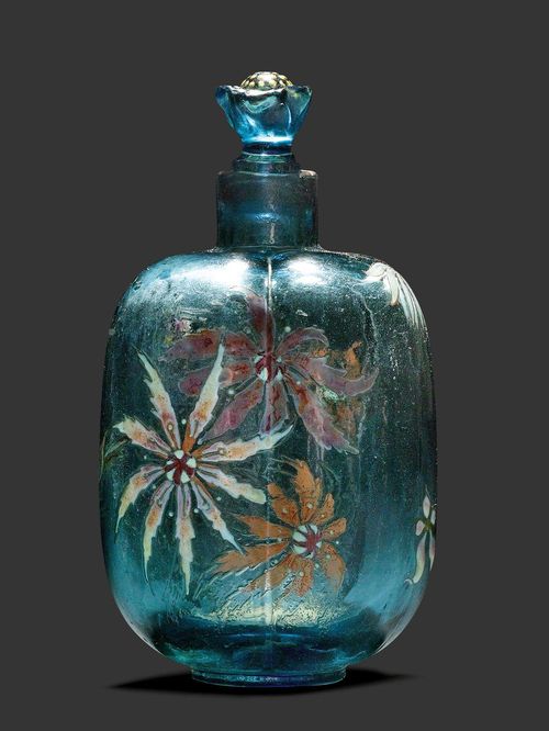 EMILE GALLE SMALL BOTTLE, circa 1890 Etched and enamelled blue glass. Signed Gallé, modèle et décor déposé. H. 13 cm.