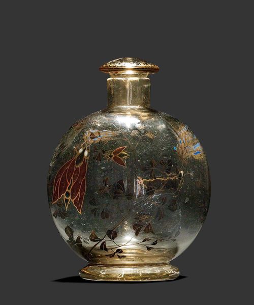 EMILE GALLE SMALL BOTTLE, circa 1880 Enamelled beige glass decorated with tendrils and butterfly. Signed E. Gallé à Nancy. H. 10 cm.