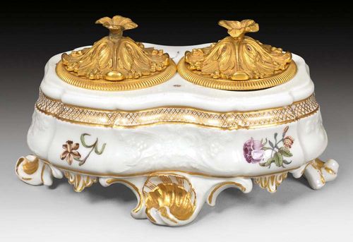 INKSTAND WITH GILT BRONZE MOUNTS, Meissen, circa 1745. With two subsequent openings for the ink containers. Gotzkowsky relief decoration. Underglaze blue sword mark. L 17.5cm.