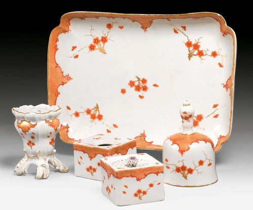 INKSTAND WITH IRON RED SCALE-PATTERN BORDER, Meissen, mid 18th century.Comprising: tray, inkwell, sander, a small flower vase and a table bell, Meissen, 19th century. Underglaze blue sword marks, inkwell lid missing (5)