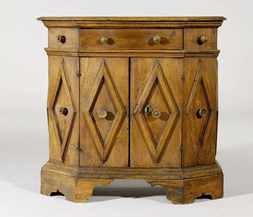 HALF-HEIGHT CABINET, in the Renaissance style, partly made of older elements, Tuscany. Walnut. Trapezoid body with drawer over double-doors. 78x31.5x76 cm.