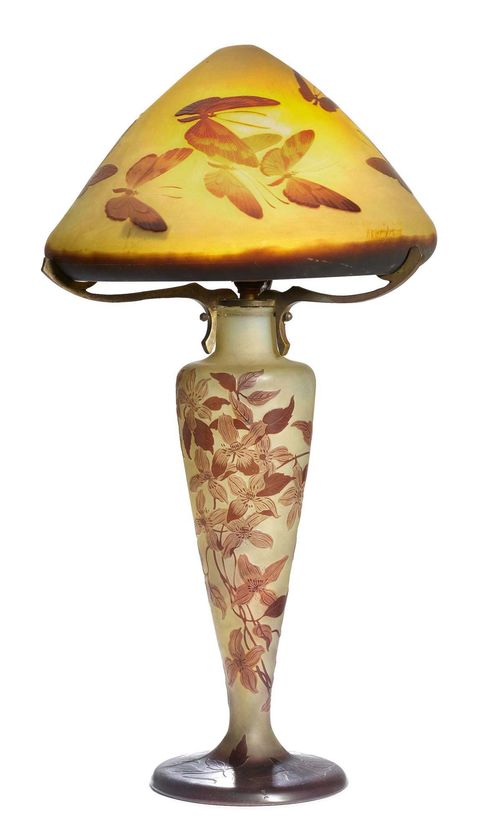 EMILE GALLE, TABLE LAMP, c. 1900. Yellow glass overlaid in violet with etched decoration. Signed Gallé. The neck of the lamp base with two small restored areas. H 57 cm.