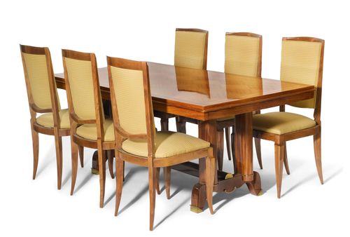 Attributed to JULES LELEU (1883 - 1961) DINING TABLE WITH 6 CHAIRS, circa 1950 Rosewood and walnut with brass trim. With yellow and green fabric covers. 95x180x75 cm.