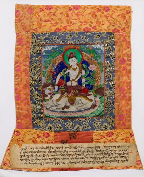 A THANGKA OF SIMHANADA AVALOKITESHVARA ON A SNOW LION. Tibet, 20th c. 24.5x21 cm. Brocade mounting with glued sutra page. Framed under glass.