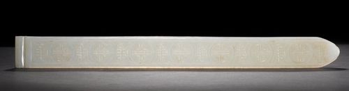 A WHITE JADE HAIR ORNAMENT CARVED WITH A FLOWER AND STYLISED SHOU CHARACTERS. China, Length 29.6 cm. Tip slightly worn, Flower with minor chipping.