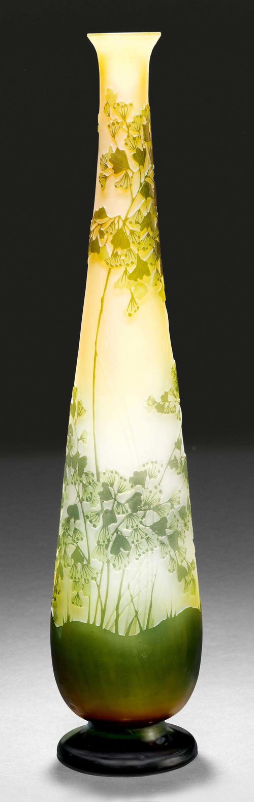EMILE GALLE VASE, ca. 1900. Yellow glass with green overlay and etching. Conical vase, decorated with ferns. Signed Gallé. H 49.5 cm.