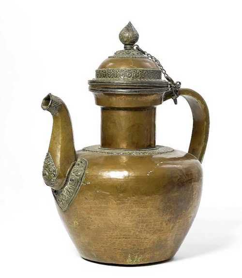 A LARGE COPPER TEAPOT, PARTIALLY SILVER PLATED, THE DOMED LID SURMOUNTED BY A SILVER LOTUS BUD KNOP.