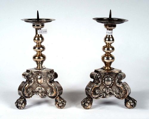 PAIR OF SHORT ALTAR LIGHTS. Probably Hildesheim circa 1717. Maker's mark probably Christian Kretzer II. Decorated with scrollwork, acanthus and cartouche with crowned coat of arms.