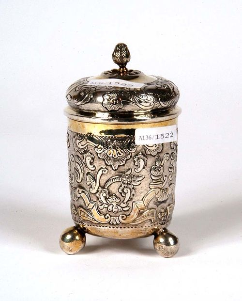 BEAKER AND COVER WITH BALL FEET, Moscow mid 18th century Inspector's mark Ivan Schagin. Maker's mark Fedor Petrow. Embossed and chased, with rocaille and floral decoration, with gilt rim.  H: 13cm , 85 g.