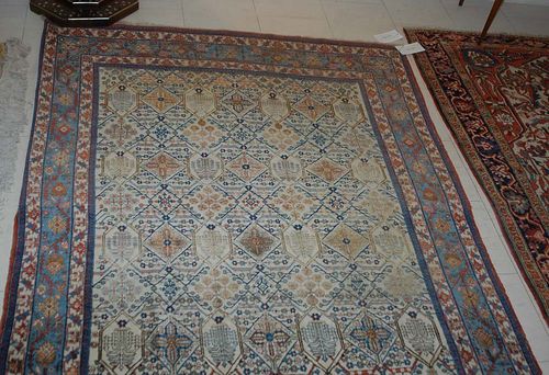 ISFAHAN old. White ground patterned with stylised plant motifs, white and blue border. Slight wear.  210x140 cm.