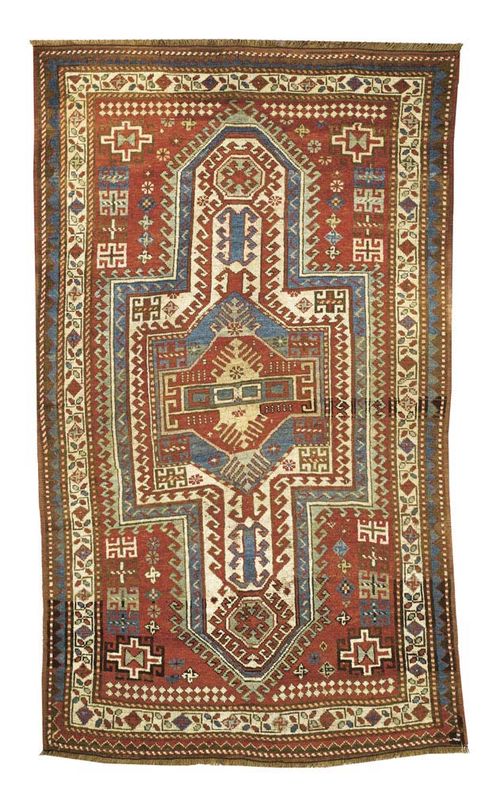 KAZAK antique. Red central field with large cross-shaped medallion, geometric patterning and narrow border. Good condition. 210x120 cm.