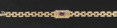 RUBY AND DIAMOND BRACELET, CARTIER. Yellow gold 750, 42g. With square sections, the central piece set with 1 oval ruby cabochon of ca. 2.00 ct and set with 18 brilliant-cut diamonds totalling ca. 0.50 ct. Signed Cartier 600838L 18 cm. matches following lot