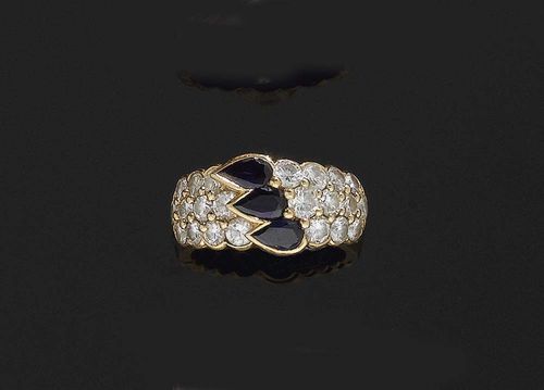 SAPPHIRE AND DIAMOND RING, LOUIS GÉRARD. Yellow gold 750. The top set with 22 brilliant-cut diamonds totalling ca. 1.00 ct and also decorated with 3 sapphire drops totalling ca. 1.00 ct . Size 52. Matches following lot