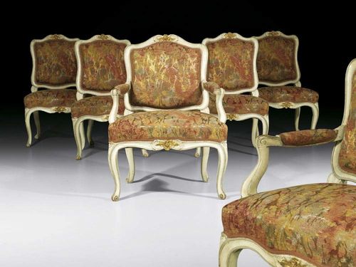 PAINTED SUITE, Louis XV, German, 18th century Comprising: 1 pair of Fauteuils and 4 chairs "à la reine". Moulded and carved wood, also painted grey and parcel gilt, upholstered with polychrome silk covers. Fauteuils 62x43x44x90 cm, chairs 53x45x42x88 cm. Provenance: from a German collection