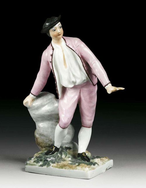 FIGURE OF A BOY, Zürich, circa 1780. Standing against a rock with his left arm stretched out, dressed in a pink jacked an trousers, wearing a black hat, no mark, 15,4cm, small repair to hat, one hand restored and chipped. Provenance: Private collection, Zürich.