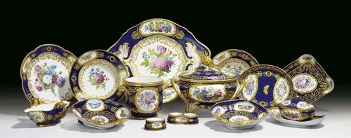 TABLE SERVICE, Paris, 19th century. In parts probably Sèvres, 18th century, decoration Paris, 19th century. With flowers and partly butterflies reserved on a dark blue ground, comprising: 12 plates, 12 soup plates, 12 small plates, 2 shell-shaped bowls 'compotiers coquilles', 2 small bowls 'plateaux losanges', 1 small bowl, 1 small tureen with cover and fixed stand ' sucrier', 1 large bowl ' jatte ronde', 1 tureen with cover and stand, 1 sauce boat, 1 salt, 1 two-part salt, 1 cooler 'seau à bouteille', Sèvres and y in blue and different  LL marks, tureen with haircracks. (51) Provenance: Private collection, St. Gallen.