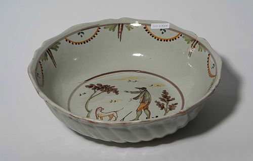 BOWL, Nevers or Bourgogne, 2nd half of the 18th century. With twist-gadrooned sides. Central medallion with shepherd. D 32.5cm. Provenance: private collection, South Germany