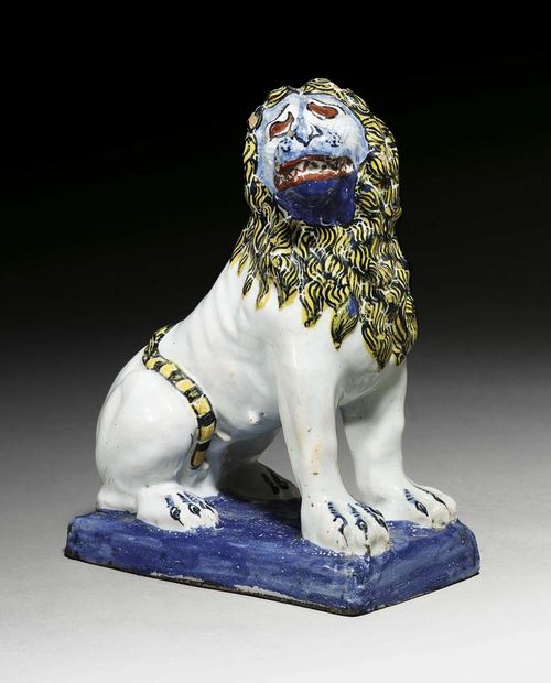 SEATED LION, Rouen, circa 1740. With light blue glaze. The face heightened in blue and iron red. H 9cm, W 8cm. One corner with flat area of wear. Provenance: private collection, South Germany Acquired in 1974 from Heinz Richert in Munich