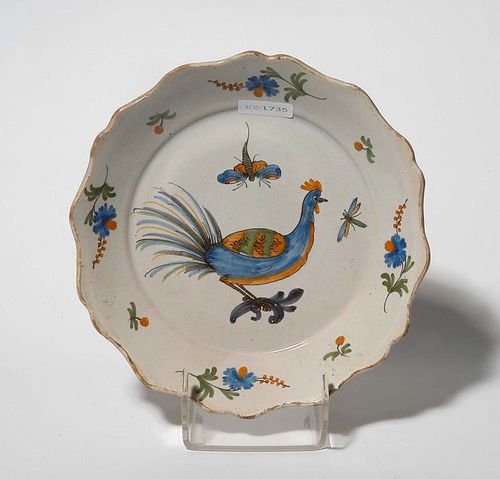 PLATE, La Rochelle or Bourgogne, late 18th century. Painted with cockerel, dragonfly and floral wreaths. D 23cm. Minor chips to rim. Provenance: private collection, South Germany