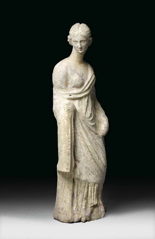 FIGURE OF A WOMAN, probably Sicily, 3rd century BC. Terracotta remains of old paint. Nose and neck repaired. H 28.5 cm. Provenance: Private collection, Zürich, acquired in 1965 at Donati, Lugano.