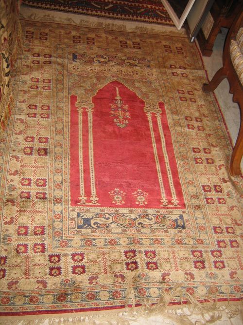 KAYSERI silk, prayer, old. Red mihrab with green spandrels, broad border in yellow with red flowers, highly restored, 175x122 cm.