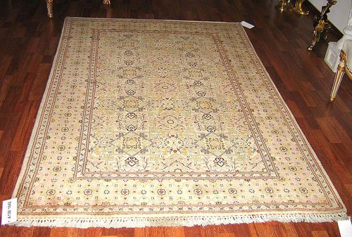 KESHAN old. The central field in white and pink with star shaped floral motifs and pink border. Good condition. 207x135 cm.