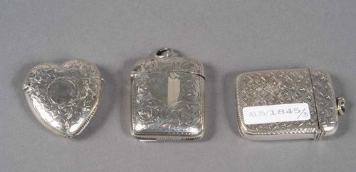 THREE SILVER MATCH BOXES, Birmingham, 1899-1902. Maker's marks. Year stamps for 1899-1900, 1900, and 1901-02. Rectangular and heart-shaped with rounded edges and hinged lids, each with cartouche for engraving of a monogram, two with eyelet for hanging. L 4.5 cm and 5.5 cm.