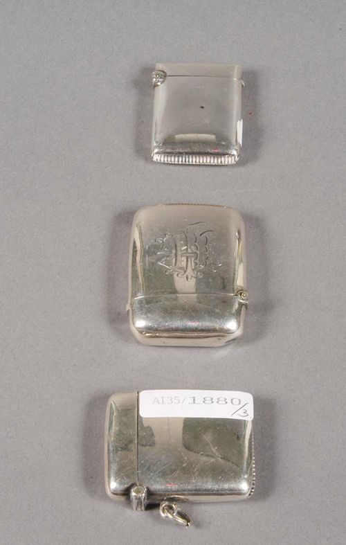 THREE SILVER MATCH BOXES, Birmingham, 1898-1907. Maker's marks. Year stamps for 1898-99, 1901, and 1907-08. One with engraved initials 'HJ', one with eyelet, L 4cm, 4.5 cm, 5 cm.