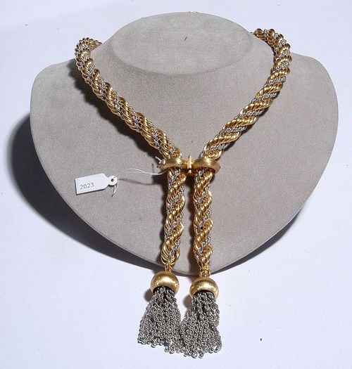 GOLD SAUTOIR. Yellow and white gold 750. 246g. Highly attractive, endless bicolour necklace with 2 decorative tassels. Satin-finished fastener clip, with an eyelet for attaching a brooch. L ca. 101 cm.
