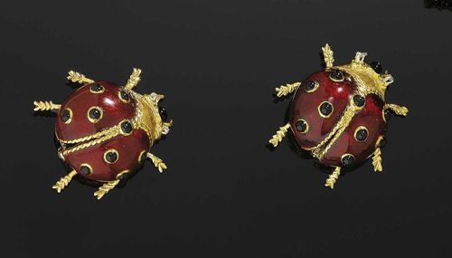 PAIR OF ENAMEL AND DIAMOND BROOCHES. Yellow gold 750. Two decorative brooches in the shape of ladybirds, the wings are decorated with red translucent enamel and black dots, the head is decorated with 1 black dot and 2 brilliant-cut diamonds for eyes.