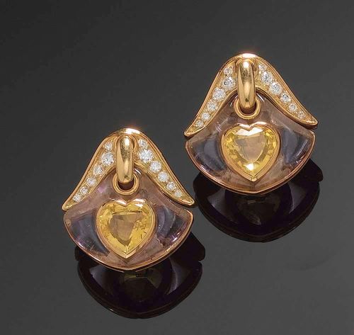 PAIR OF SAPPHIRE, AMETHYST AND DIAMOND EARCLIPS, BULGARI. Yellow gold 750. Of stylised tulip design, decorated with 2 heart-shaped yellow sapphires totalling ca. 6.29 ct, 4 amethysts totalling ca. 2.10 ct and 24 diamonds totalling ca. 0.70 ct.