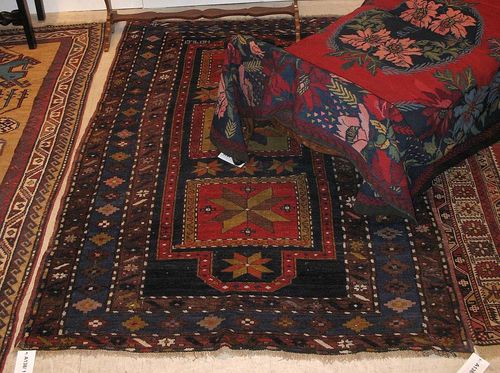 KAZAK old. Blue central field with three large square medallions, decorated throughout with star motifs, broad triple stepped border, dated 1946, Good condition. 225 x 140 cm.