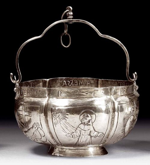 INCENSE BURNER. Italian, probably 18th century.With mark. Curved form on a round base ring. On both sides: lion masks as the ends of a simple, curved handle. With a surround of cartouches with Christian symbols and depictions of saints. Engraving on the upper rim of the vessel: " PETRI BAPTAE A MESSA TEPORE R.P.F." 8.5x14 cm. 250 g. Formerly part of the Bulgari Collection.