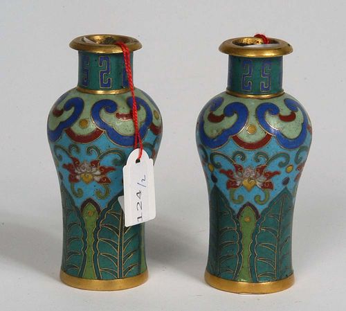 PAIR OF SMALL CLOISONNÉ VASES in Meiping form. Turquoise lotus decoration with gilding. With broad banana leaf border at the base and the Ruyi border covering the shoulder. S-shaped patterns on the neck. China, around 1800, H 9.3 cm. Slightly damaged. (2) Berti Aschmann Collection.
