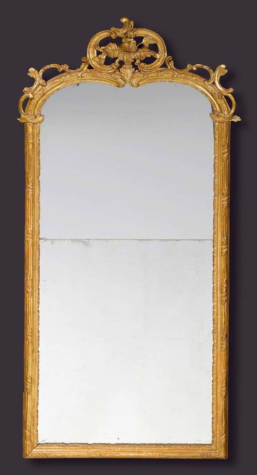 PIERCED AND CARVED GILTWOOD MIRROR,Louis XV, J.F. FUNK (Johann Friedrich Funk, 1706 Bern 1775) attributed, Bern, 18th century With two-part mirror plate. H 175 cm, W 76 cm. Provenance: Château de Vincy, West Switzerland.