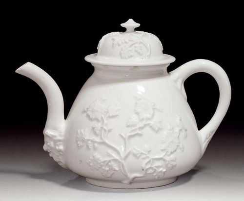 WHITE BÖTTGER TEAPOT WITH LID, Meissen, circa 1720-30.With applied flowers. The spout with lion mask. The lid with similar applied foliate applications. No mark. D 10cm. Small chips to upper edge and spout.