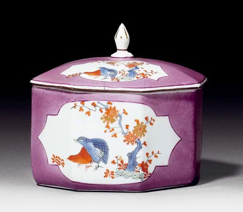 SUGAR BOWL WITH QUAIL MOTIF, Meissen, circa 1740.Painted on both sides with purple four-sided cartouches, the front with quail motif and the back with Indiansiche Blumen in Kakiemon style on purple ground. Matching lid. Underglaze blue sword mark, impressed number 29. D 9.5cm. The finial replaced. Provenance: from a private collection, Solothurn