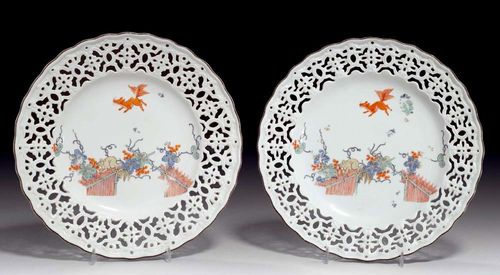 PAIR OF PLATES WITH KAKIEMON DECORATION, Meissen, circa 1740.The shaped sides pierced and painted with 'Eichhörnchendekor'. Underglaze blue sword mark, impressed number 21. D 23.4cm.