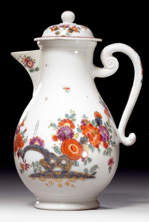 COFFEE POT ADN LID WITH "INDIANISCHEN BLUMEN", Meissen, circa 1730.Painted with bridge and rocks with Indianischen Blumen in underglaze blue. The lid with identical decoration and purple border with flowers in gold, yellow and iron red. Underglaze blue sword mark, blue painter's mark and potter's mark X. H 19.8cm. Spout and part of upper rim restored. Provenance: from a private collection, Solothurn