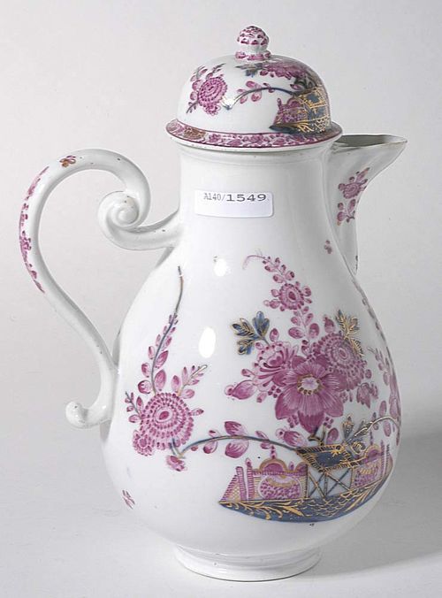 COFFEE POT WITH "TISCHCHEN" PATTERN, Meissen, second half of the 18th century.Painted in purple and underglaze blue heightened in gold with Indianischen Blumen, on a console with Tischchen. The similarly decorated lid with 'Bamberg' border with flower in gold. Underglaze blue sword mark. H 23.5cm. Provenance: from a private collection, Solothurn