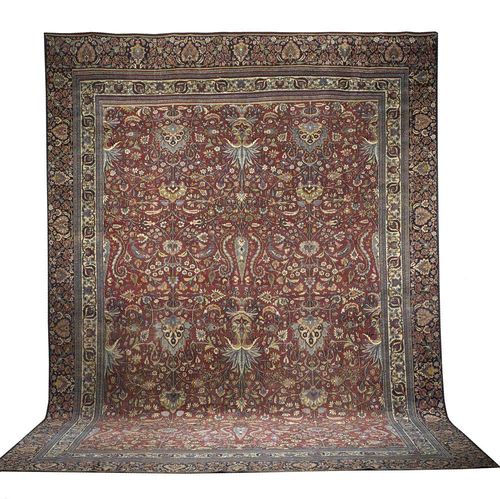 DOROSH old. Red central field lavishly decorated with trailing flowers and palmettes in pinks and tones,  white and blue border. Some wear, one side border missing.  540x370 cm.
