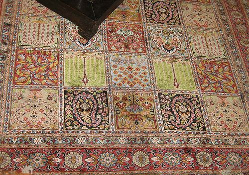 GHOM silk, Garden carpet, signed. Blue-green central medallion on old rose ground with light corner motifs, finely decorated with trailing flowers and palmettes, dark blue border with birds and flowers, good condition, 331x210 cm.