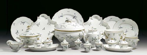 AN ASSOCIATED PART TABLE SERVICE ‚A FLEURS BARBAUX', Paris and other factories, circa 1780.With scattered cornflowers, rims partly gilt. Paris factories: 1 soup tureen, 2 coolers, 1 glass cooler, 1 ecuelle and cover, 2 large bowls, 2 square bowls, 1 cooler cover, 7 plates, 4 soup plates, 3 small plates, 1 kidney-shaped plate, 1 small oval dish, 1 footed bowl, 1 circular bowl, 2 'confituriers à deux', 4 ice-cups and covers, 2 sauce-boats, 6 small cups, 8 medium size cups, 14 saucers, 2 different coffee pots and covers, 1 tea pot, 1 milk jug and 1 sugar bowl and cover. Parts without marks: 2 oval soup tureens and covers, 2 small oval tureens and covers on fixed stands, 2 boat-shaped bowls, 2 salts, 2 oval baskets with stands (restored), 1 circular pierced basket, 1 polygonal bowl, 2 small circular bowls, 6 shell-shaped bowls, 3 big plates with pierced rim, 2 pierced liners, 7 oval dishes in different sizes, 5 circular dishes in different sizes, 19 small plates, 17 soup plates, Paris, 18th and 19th century, factory marks in underglaze-blue and iron-red (142 pieces); TOGETHER WITH 125 associated pieces with restorations and damages. (267 pieces ).